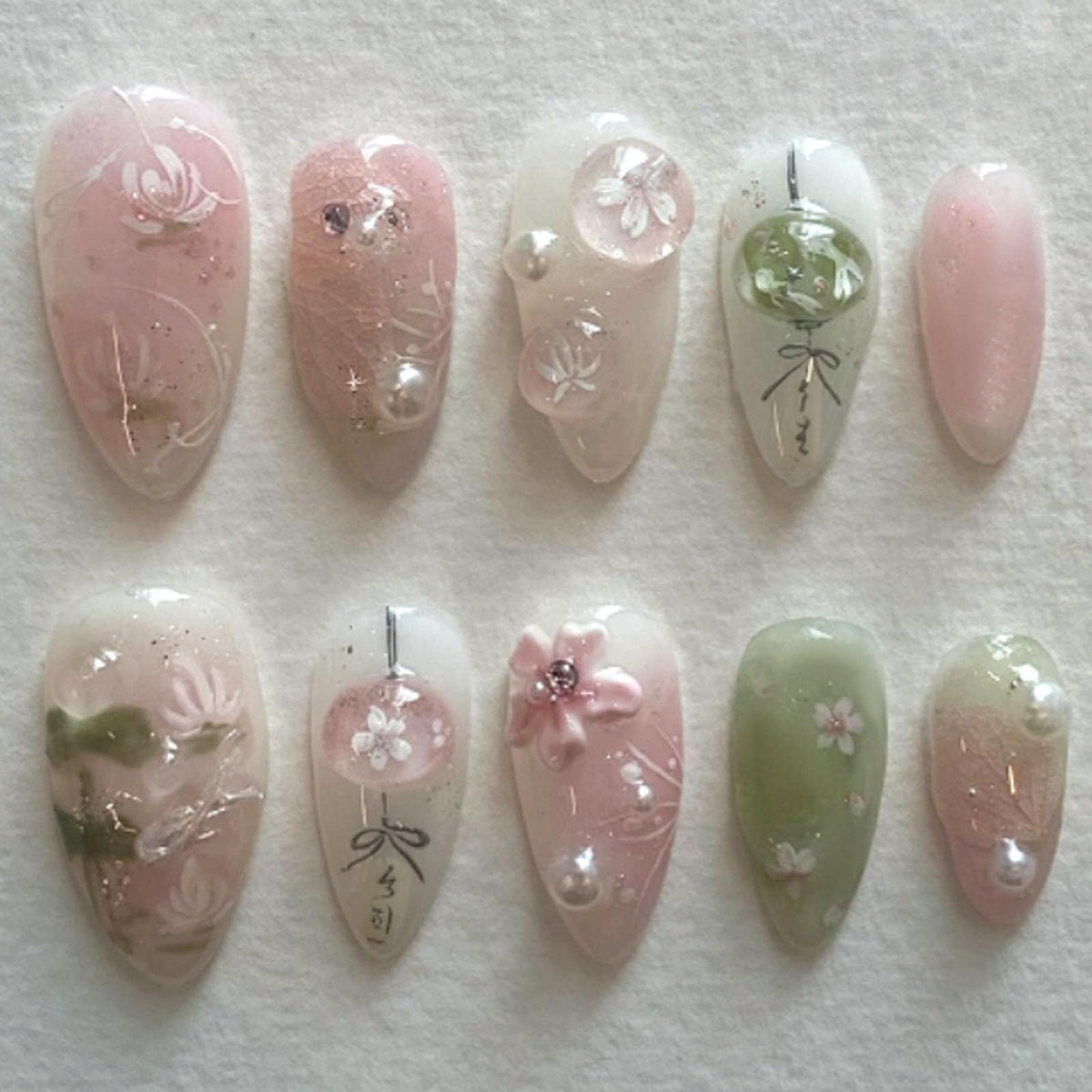 Spring Press on Nails Almond Medium Fake Nails with White Flower Designs French Tip Nails Press ons Light Green False Nails Glossy Glue on Nails Acrylic Nails Nude Stick on Nails for Women 24Pcs